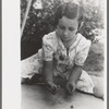 Little girl playing jacks at the Casa Grande Valley Farms, Pinal County, Arizona