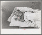 Little girl taking nap at the Work Projects Administration nursery school at the Casa Grande Valley Farms, Pinal County, Arizona