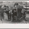 Cranking up motor which will supply power for the miners drilling contest, Labor Day celebration, Silverton, Colorado