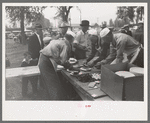 Serving barbecue at the free barbecue on Labor Day at Ridgeway, Colorado