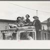 Miner's family on top of truck watching Labor Day contests, Silverton, Colorado