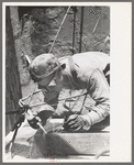 Spot welder at work on Shasta Dam, Shasta County, California