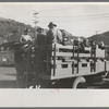 Construction workers on truck which will carry them to work on Shasta Dam, Shasta County, California