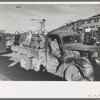 Construction workers on truck which will carry them to work on Shasta Dam, Shasta County, California