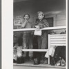 Construction workers on front porch of commissary, Shasta Dam, Shasta County, California