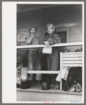 Construction workers on front porch of commissary, Shasta Dam, Shasta County, California
