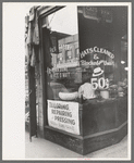 Many Negroes are employed in small enterprises such as this one on the South Side of Chicago, Illinois