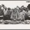 Helping the plates at dinner on the grounds, all day community sing, Pie Town, New Mexico