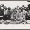 Helping the plates at dinner on the grounds, all day community sing, Pie Town, New Mexico