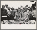 Helping the plates at dinner on the grounds, all day community sing, Pie Town, New Mexico