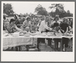 Farm folks, mostly homesteaders, at dinner during the all day community sing, Pie Town, New Mexico