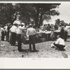 Dinner on the grounds at all day community sing, Pie Town, New Mexico. The tables are left in place permanently and are used frequently by the entire community for picnics and dinners