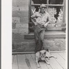 Gold miner with his dog, Mogollon, New Mexico