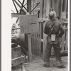 Gold miner waiting for cage to be lowered underground, Mogollon, New Mexico
