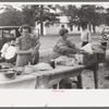 Taking out food for dinner at the day community sing, Pie Town, New Mexico