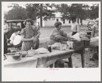 Taking out food for dinner at the day community sing, Pie Town, New Mexico