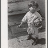 Spanish-American boy playing horse, Chamisal, New Mexico