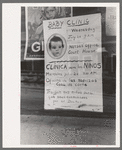 Sign in post office window announcing baby clinic, Taos, New Mexico