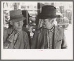 Men talking on the streets of Taos, New Mexico