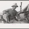 Mormon farmer who lives in Snowville, Utah and who farms in Oneida County, Idaho, bagging wheat