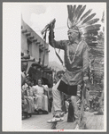 A member of the Forest Service who is participating in Indian dances at the fiesta, Taos, New Mexico