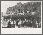 Crowds lined the streets and stood on top of covered sidewalks to see the dances at the fiesta, Taos, New Mexico