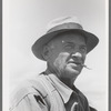 Checker, labor contractor's pea pickers crew, Nampa, Idaho
