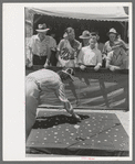 Tossing coins concession at the Fourth of July celebration, Vale, Oregon