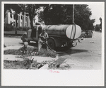 Filling the street-sprinkling wagon, Caldwell, Idaho