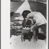 Little girl plays with her doll, Caldwell, Idaho