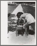 Little girl plays with her doll, Caldwell, Idaho