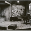 Photograph of empty staged set design by Boris Aronson (Anne's room, wall covered with pictures)