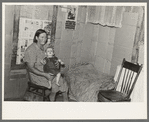 Mrs. H. Gerling and baby in living room in farmhouse near Wheelock, North Dakota