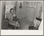 Mrs. H. Gerling and baby in living room in farmhouse near Wheelock, North Dakota