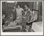 Family of Frank Peaches in their living room farm near Williston, North Dakota