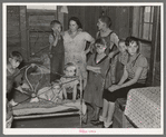 Family of Frank Peaches in their living room farm near Williston, North Dakota