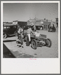 Loading supplies into farmer's wagon, Littlefork, Minnesota