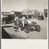 Loading supplies into farmer's wagon, Littlefork, Minnesota
