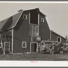 Threshing machine and barn near Littlefork, Minnesota