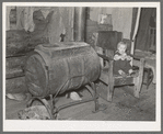 Homemade stove in farmhouse on cut-over land near Northome, Minnesota