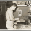 Camp cook making rolls. Logging camp near Effie, Minnesota