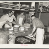 Dishing out and serving food in logging camp near Effie, Minnesota