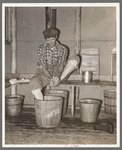 Lumberjack washing his feet. Camp near Effie, Minnesota