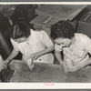 Putting rice in cellophane packages. Abbeville, Louisana