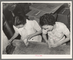 Putting rice in cellophane packages. Abbeville, Louisana