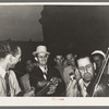 Two Cajun musicians with Mr. Wilson, Secretary of the National Rice Festival Association standing between them