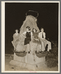 Sitting on decorated water trough watching the night parade at the National Rice Festival. Crowley, Louisiana