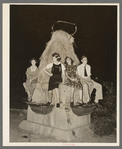 Sitting on decorated water trough watching the night parade at the National Rice Festival. Crowley, Louisiana