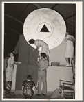 Decorating float of state of Louisiana with the token symbol of the state welfare tax prominently displayed. National Rice Festival, Crowley, Louisiana
