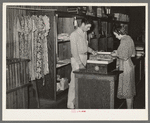 Dress and dry goods counter. Cooperative general store. Lake Dick Project, Arkansas